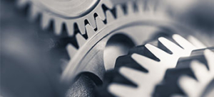 Close-up image of interlocking metal gears, representing precision, engineering, or seamless mechanical operation.