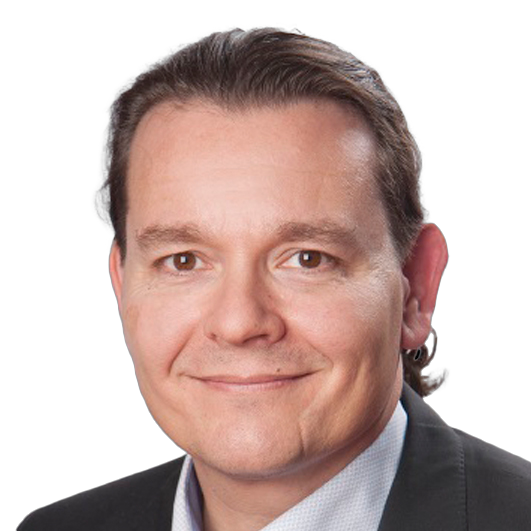 Professional business portrait showing an individual wearing a formal suit jacket and collared shirt against a clean white background, representing corporate professionalism and an executive business profile.