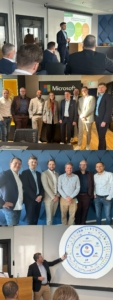 Gruppe von Menschen, die vor einer Wand mit Microsoft-Logo stehen.